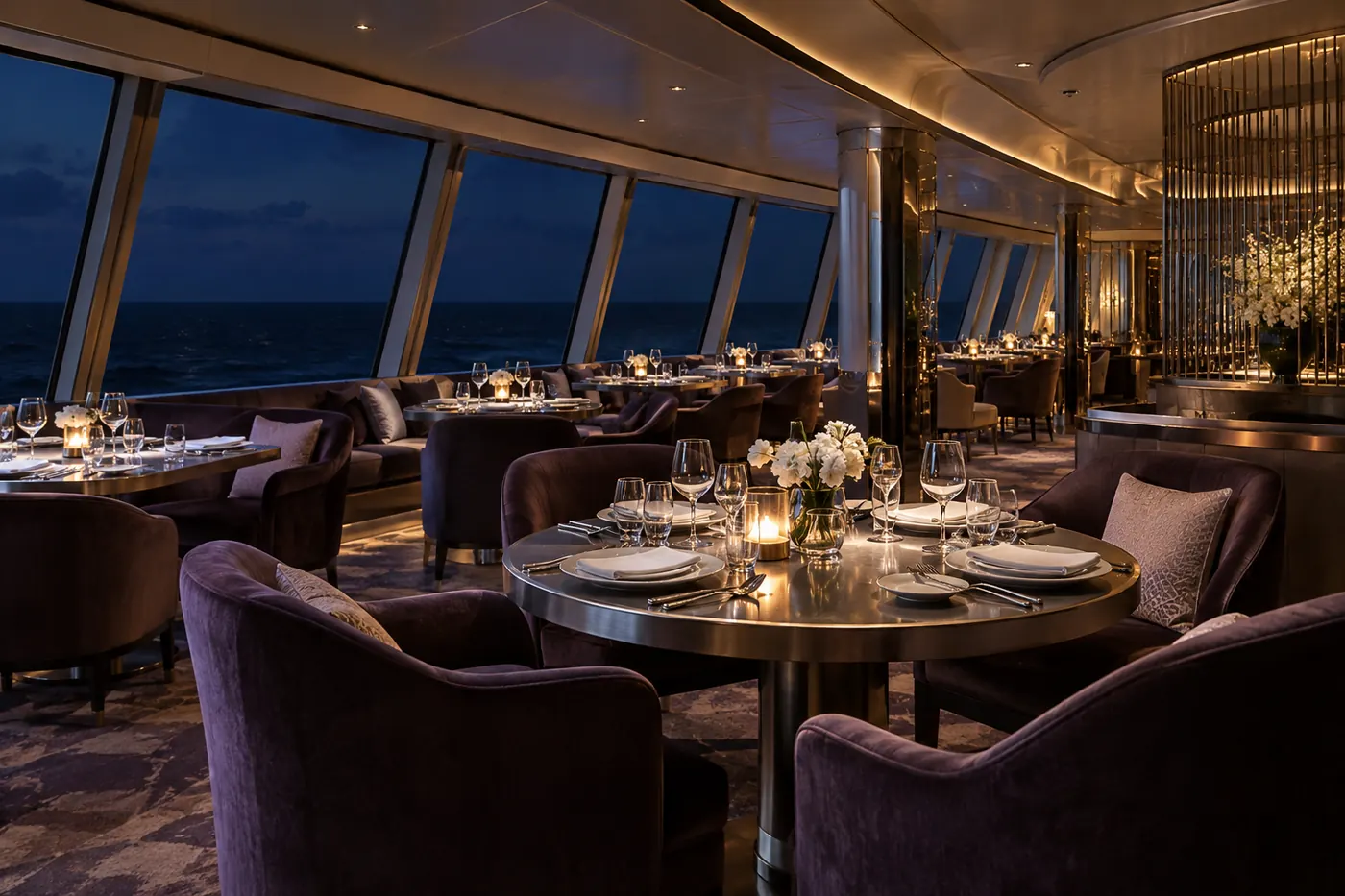 Contemporary shipboard dining lounge with violet seating, silver table settings and the dark sea beyond